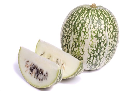 Close up view of a green striped green pumpkin isolated on a white background.