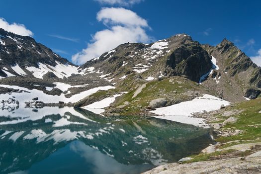 summer view of Red Stone Lake, Aosta valley, Italy