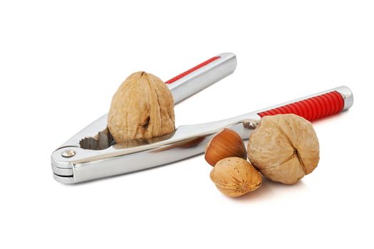 detail of nutcracker with almond walnuts and nuts isolated on white background