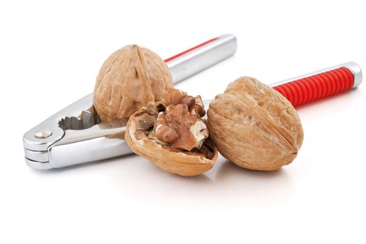 detail of nutcracker with walnuts isolated on white background