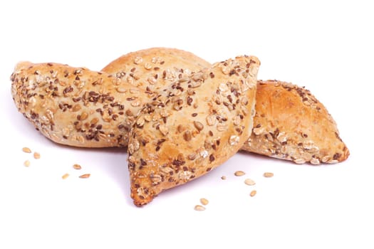 Close view of some fresh cereal bread isolated on a white background.