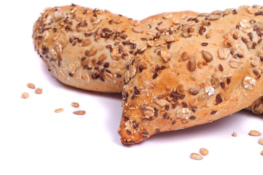 Close view of some fresh cereal bread isolated on a white background.