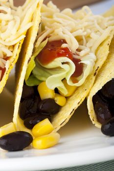 Homemade vegetarian tacos with black beans and sweet corn.