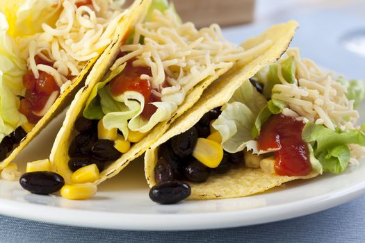 Homemade vegetarian tacos with black beans and sweet corn.
