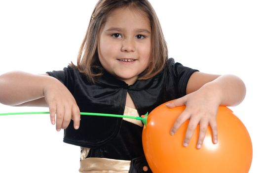 A young girl is putting a stick on the end of a balloon, isolated against a white background