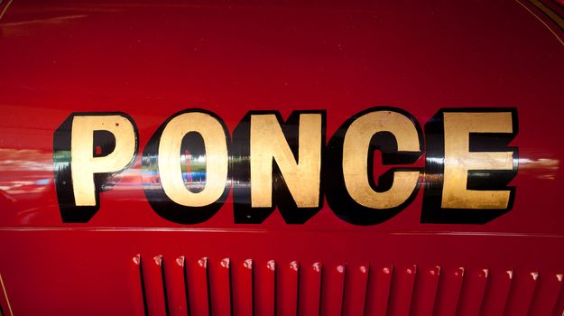 Old name on side of fire truck in Ponce in Puerto Rico