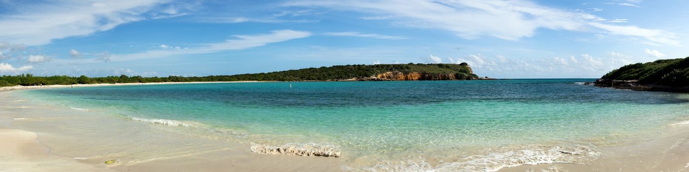 Circular sandy bay off the south west coast of Puerto Rico by Los Morillos Lighthouse