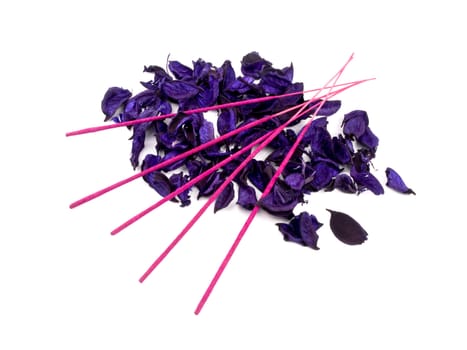 Aromatic purple potpourri and pink incenses on white background