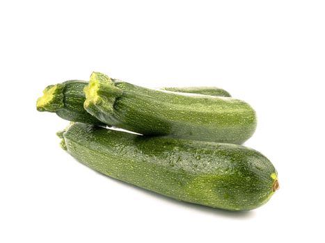 Fresh green zucchini on white background