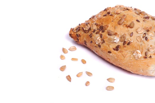 Close view of some fresh cereal bread isolated on a white background.