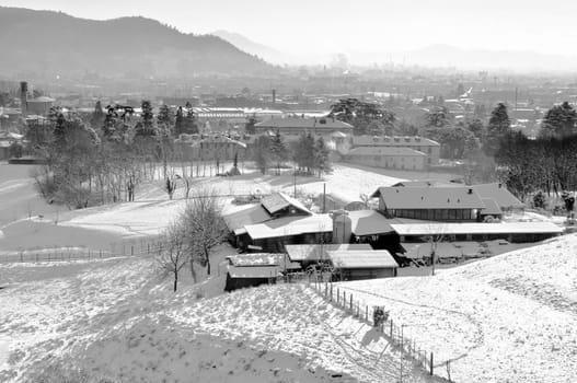 Italian farm with white frozen landscape in winter