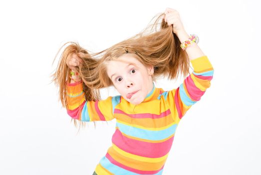 studio shot of pretty little girl with a fun grimace