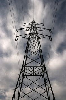 Electric pillar against dramatic sky