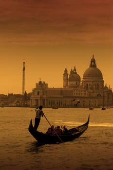 Gondolier at the dusk in Venice, Italy