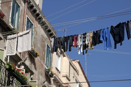 Linens and clothes dries outdoor. Venice street, Italy 