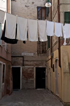 Linens and clothes dries outdoor. Venice street, Italy