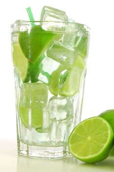 green cocktail with ice cubes and copyspace