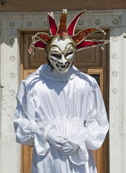 VENICE, ITALY - APRIL 10, 2011, unidentified masked person in traditional venetian costume.