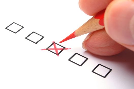 marketing concept with checkbox from questionnaire and red pencil