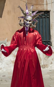 VENICE, ITALY - APRIL 10, 2011, unidentified masked person in traditional venetian costume.