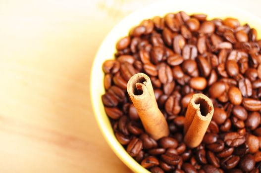 coffee beans and cinnamon with copyspace showing food concept
