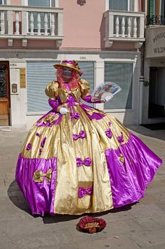 VENICE, ITALY - APRIL 10, 2011, unidentified masked person in traditional venetian costume.