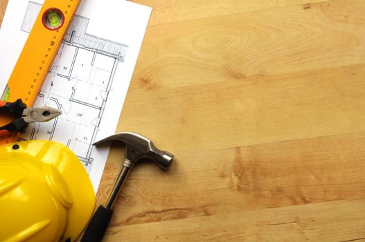 real estate concept with hard hat blueprints tools and copyspace