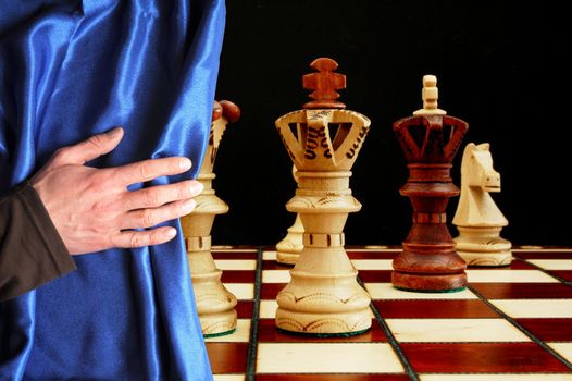 chess and curtain showing strategic business behavior