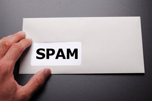 spam mail or e-mail concept with word on evelope