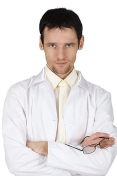 The serious young man in a hospital gown on white