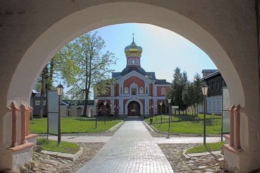 View through  arch of  church Iversky Monastery, Russia.