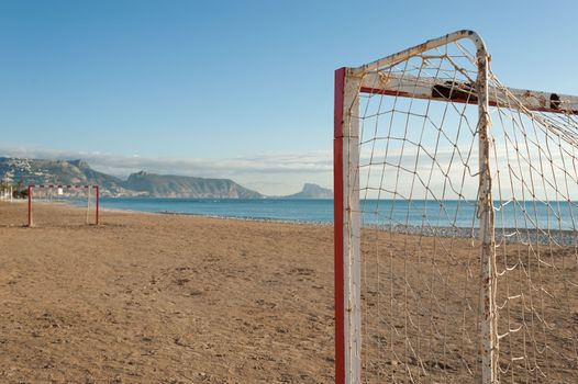 Small five-to-five soccer goals on a sandy beach