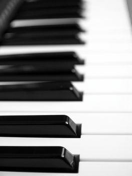 Detail of black and white keys on music keyboard - selective focus