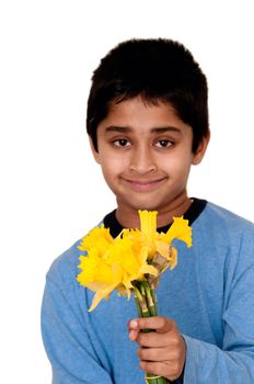 An handsome Indian kid holding Daffodil to welcome the arrival of spring