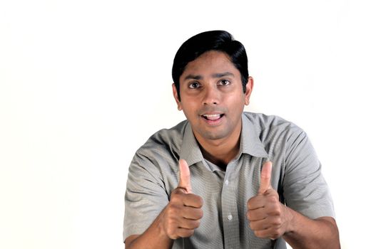 An handsome indian man looking very excited