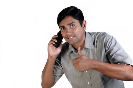 An handsome Indian businessman on call all the time