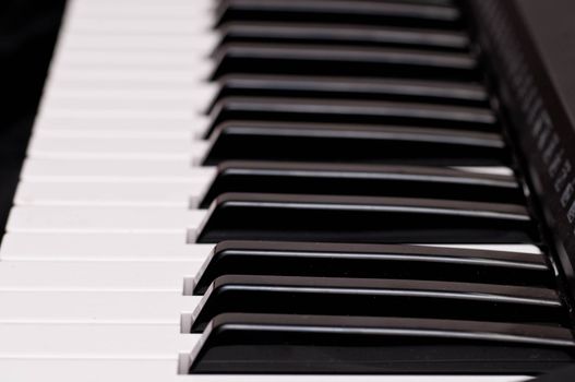 close up shot of black and white keys of a piano