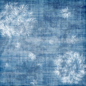 Dandelions over blue, grunge background