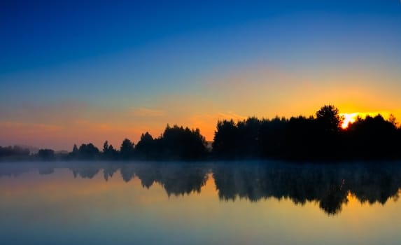 dramatic sunrise on lake