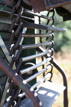 Metal chains on a spud harvester