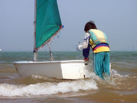 She is too young and to climb up to the ship