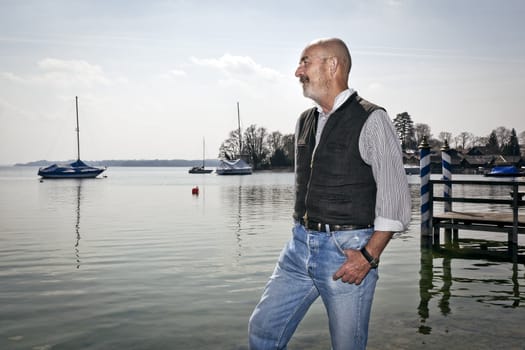 An old man relaxing at the lake Starnberg