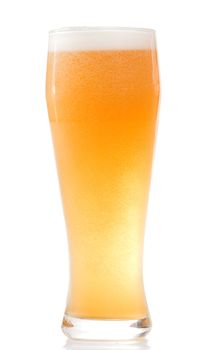 Full misted glass of beer isolated on white background.