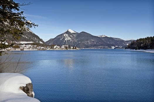 An image of the Walchensee in Bavaria Germany covered in snow