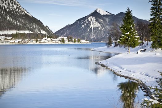 An image of the Walchensee in Bavaria Germany covered in snow