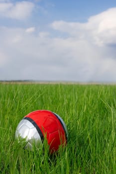 Soccer ball on a green field