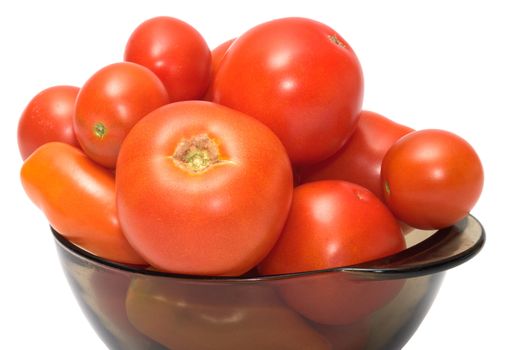 Red tomatoes on a dish it is isolated on a white background