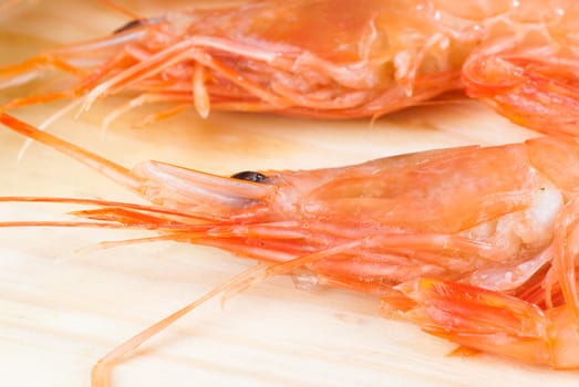 Fresh prawns or shirmps on a wooden board