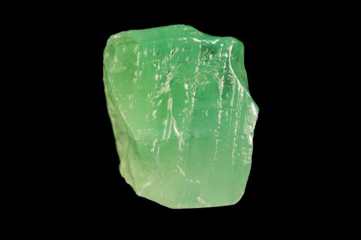 Green mineral calcite on black background.