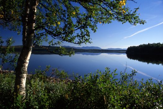 Beautiful blue lake as a mirrow with reflection